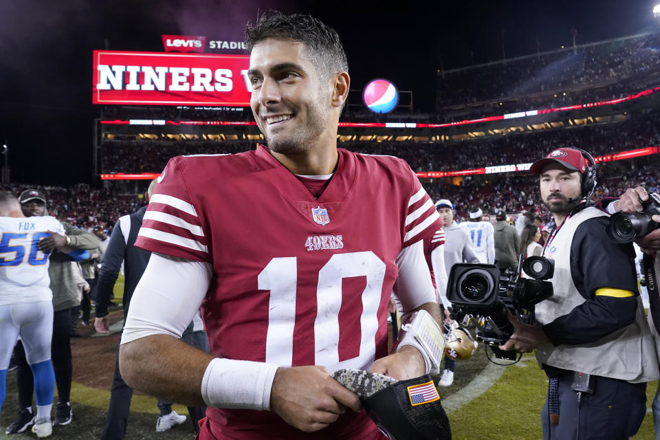 San Francisco 49ers quarterback Jimmy Garoppolo (10) smiles after the 49ers defeated the Los Angeles Chargers in an NFL football game in Santa Clara, Calif., Sunday, Nov. 13, 2022. (AP Photo/Godofredo A. Vásquez)