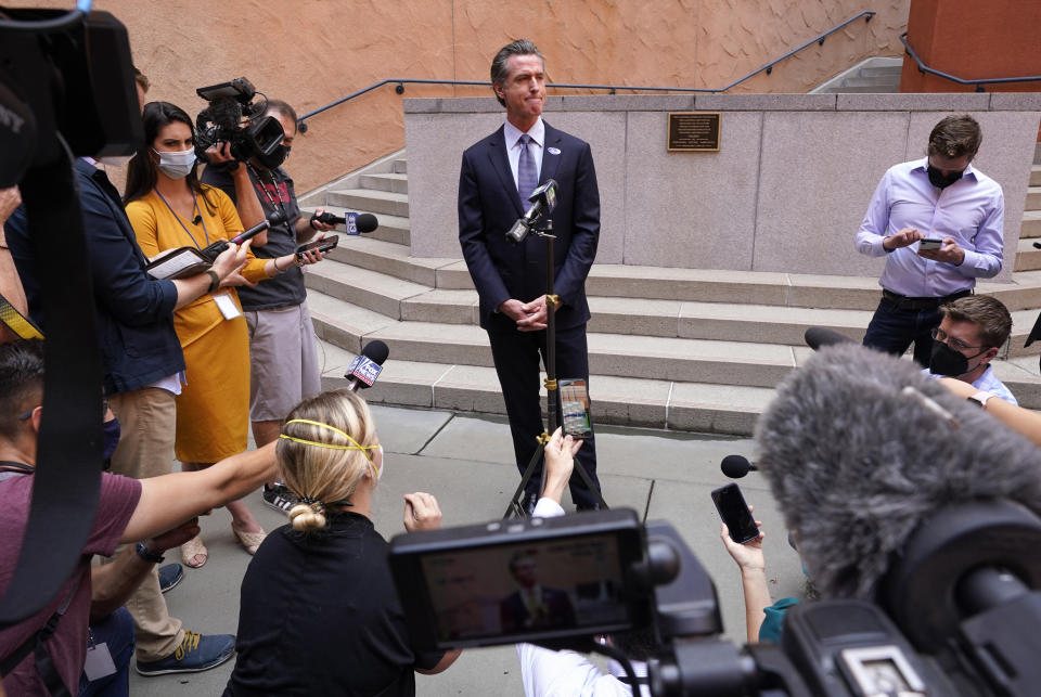 California Gov. Gavin Newson listens to a question while meeting with reporters after casting his recall ballot at a voting center in Sacramento, Calif., Friday, Sept. 10, 2021. The last day to vote in the recall election is Tuesday Sept. 14. A majority of voters must mark "no" on the recall to keep Newsom in office. (AP Photo/Rich Pedroncelli)