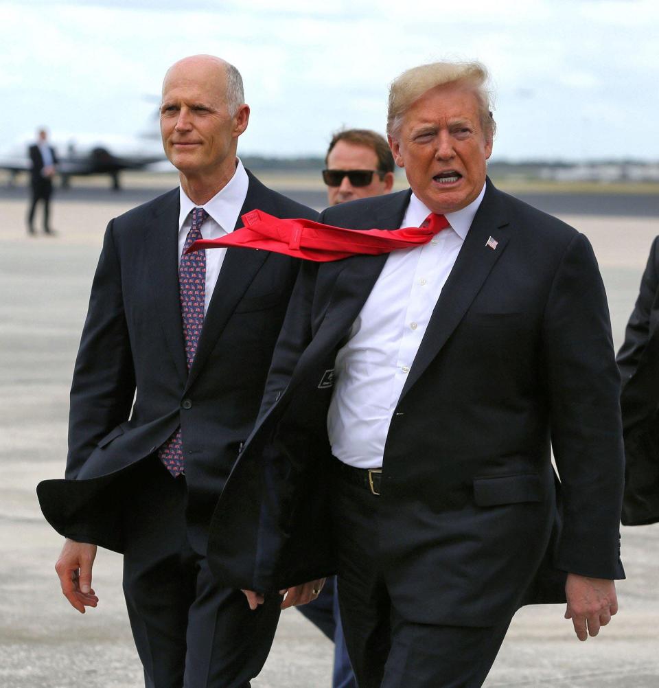 U.S. Sen. Rick Scott, seen at left with then-President Donald Trump in 2018, pushed two school prayer bills while he was governor of Florida.