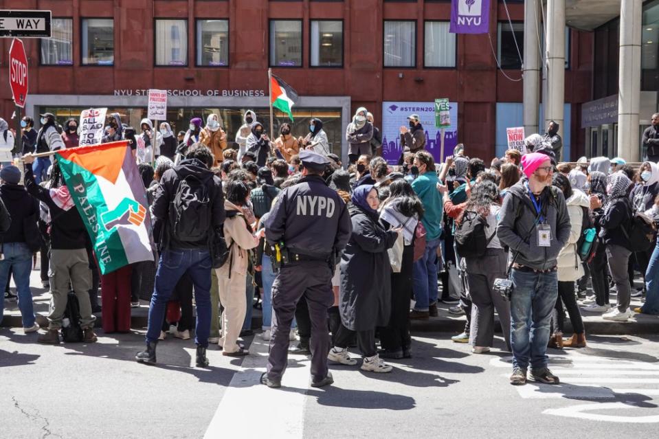 The students were seen waving Palestinian flags on the streets and sidewalks, with others hanging up signs to “Honor the Martyrs of Palestine.” LP Media