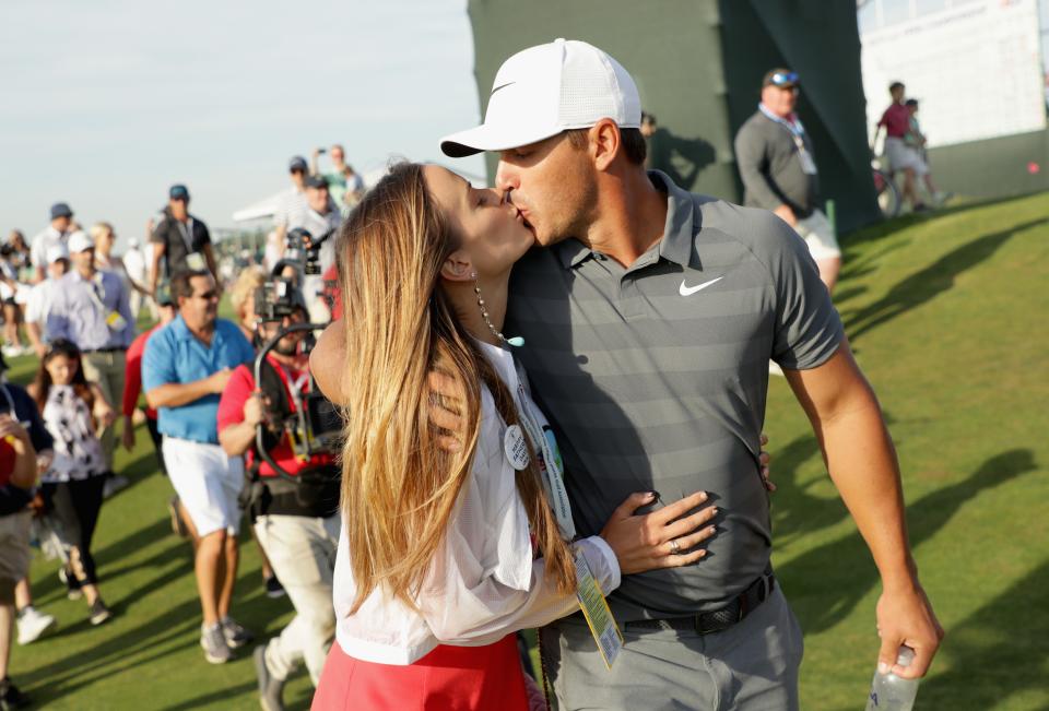 SOUTHAMPTON, NY - JUNE 17:  Brooks Koepka of the United States kisses girlfriend Jena Sims as they walk off the 18th green during the final round of the 2018 U.S. Open at Shinnecock Hills Golf Club on June 17, 2018 in Southampton, New York.  (Photo by Streeter Lecka/Getty Images)