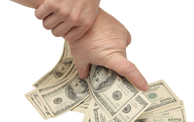 A fist full of hundreds (Thinkstock)