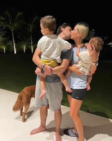 <p>Claire Holt Instagram</p> Claire Holt and Andrew Joblon with their kids on New Year's Eve 2021