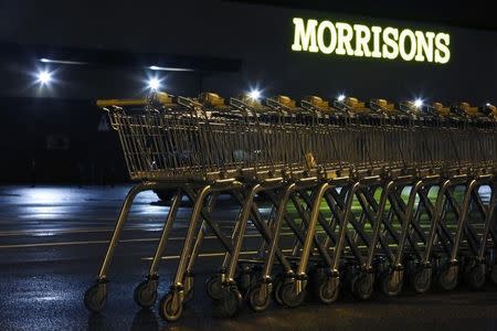Shopping trolleys are stacked in the car park of a Morrisons supermarket store in Croydon, south London January 12, 2015. REUTERS/Luke MacGregor