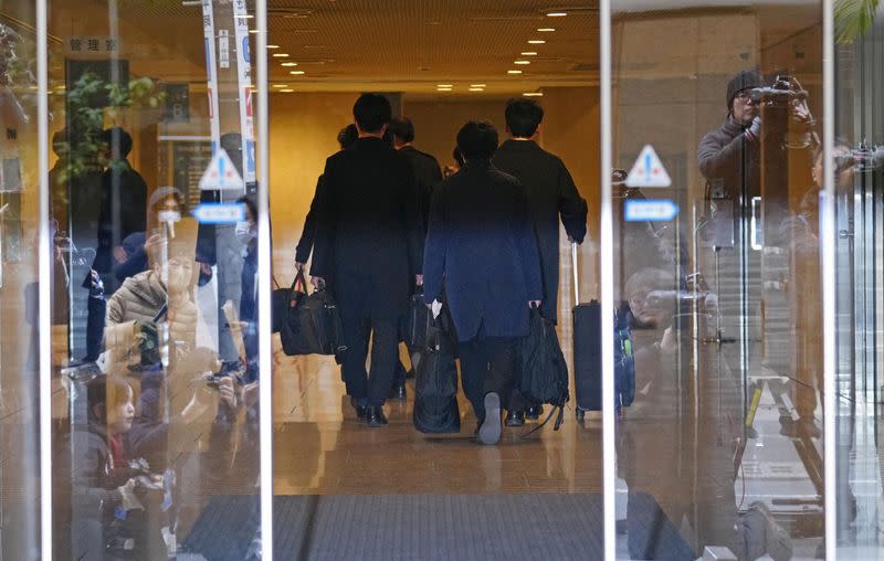 Investigative team members from the Tokyo District Public Prosecutors Office search office of key ruling party faction in Tokyo