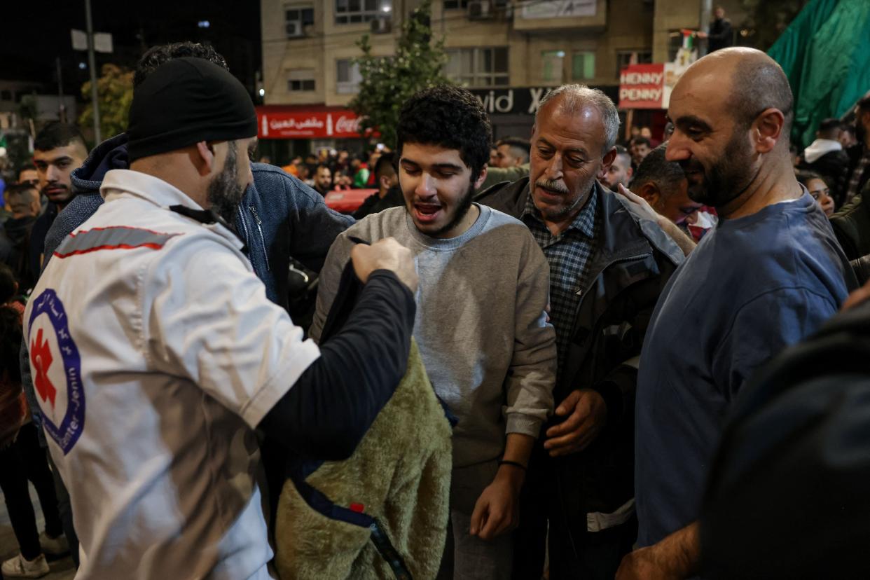 A Palestinian prisoner (C) is welcomed in Ramallah, West Bank, by relatives after detainees were released from Israeli jails (AFP via Getty Images)