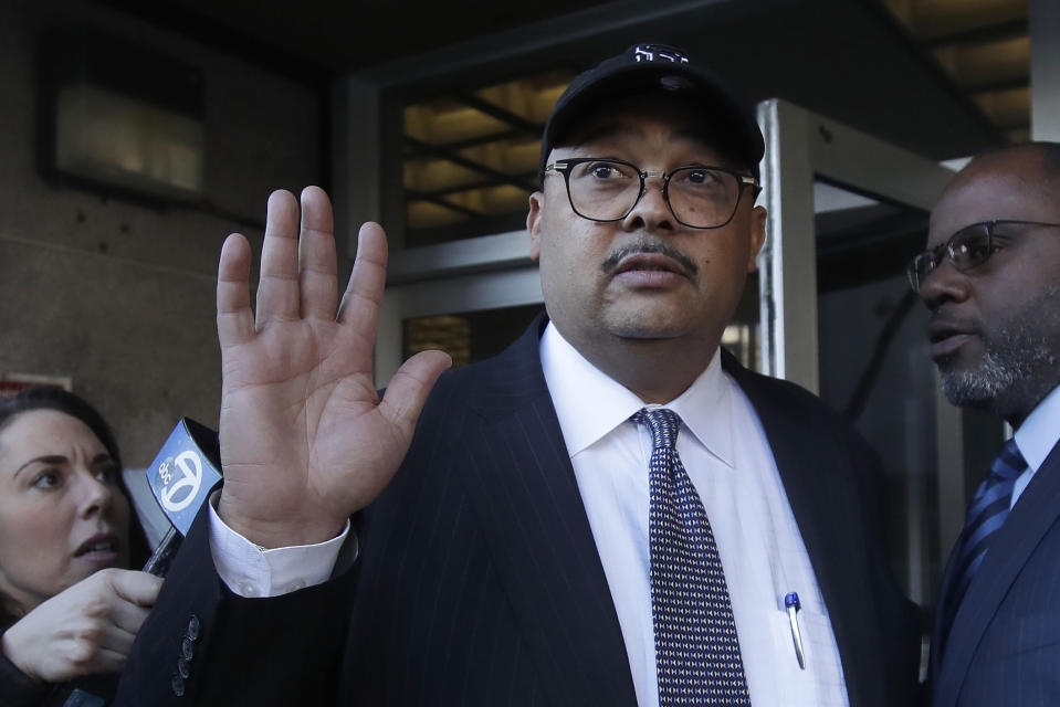 FILE - Mohammed Nuru, then-director of San Francisco Public Works, center, leaves a federal courthouse with attorney Ismail Ramsey, right, on Feb. 6, 2020, in San Francisco. San Francisco's former public works director, who pleaded guilty to steering public contracts and taking pricey gifts, was sentenced Thursday, Aug. 25, 2022, to seven years in prison in a corruption case that ensnared several City Hall officials and insiders. (AP Photo/Jeff Chiu, File)