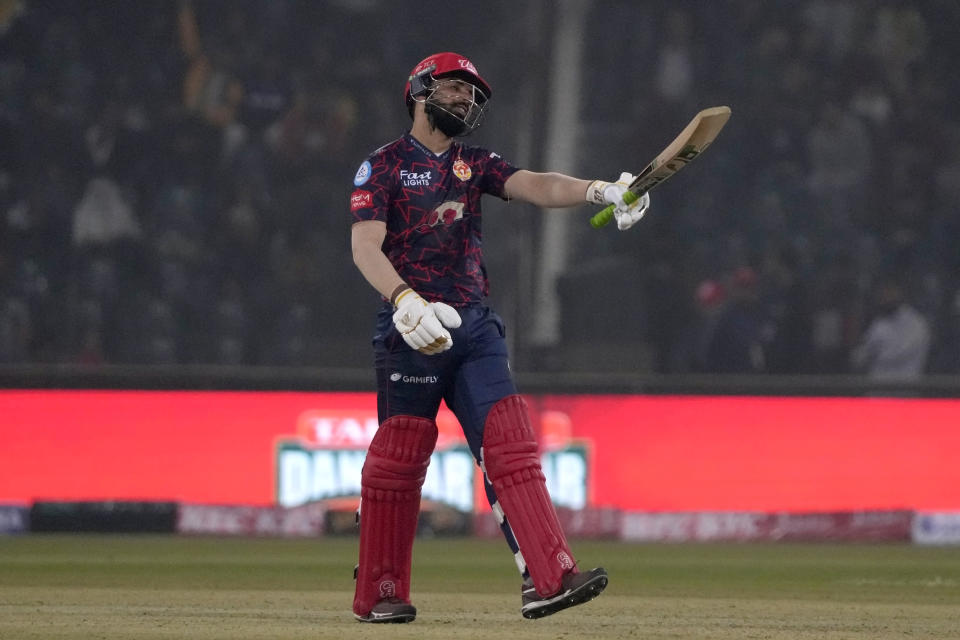 Islamabad United' Shadab Khan celebrates after scoring fifty during the Pakistan Super League T20 cricket match between Islamabad United and Lahore Qalandars, in Lahore, Pakistan Saturday, Feb. 17, 2024. (AP Photo/K.M. Chaudary)