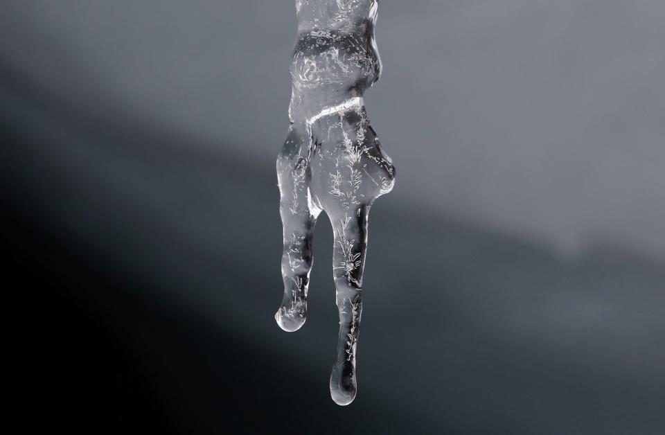 Water drips from an icicle at the leading edge of the Pastoruri glacier in Huaraz