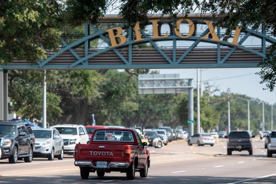 A vintage Toyota truck drives under the Biloxi sign during Cruisin’ the Coast, on Wednesday, Oct. 4, 2023.