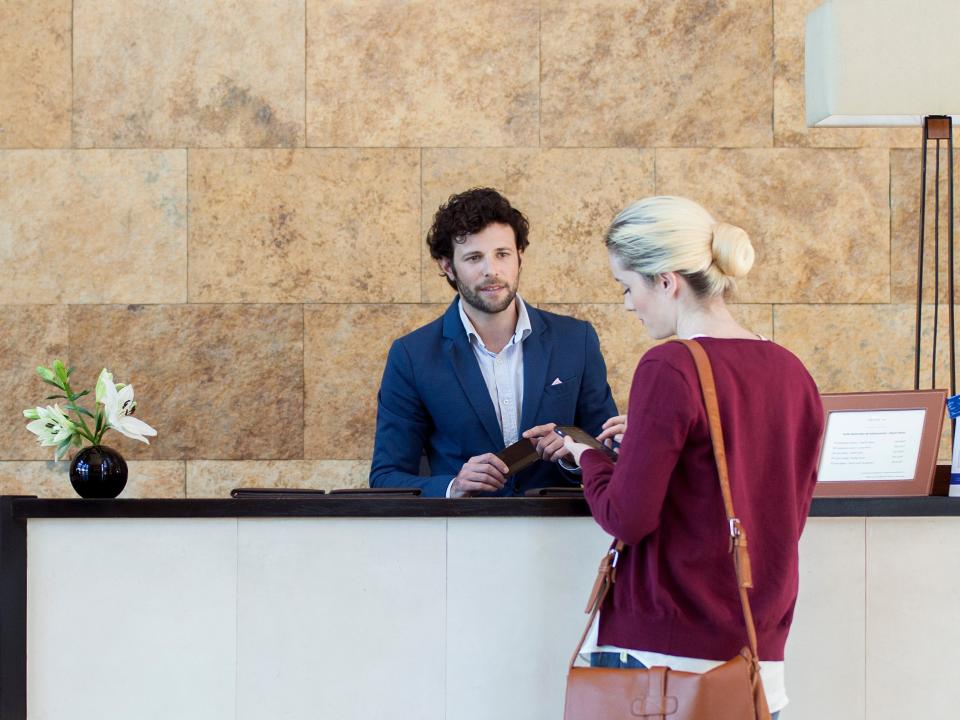 woman checking into hotel