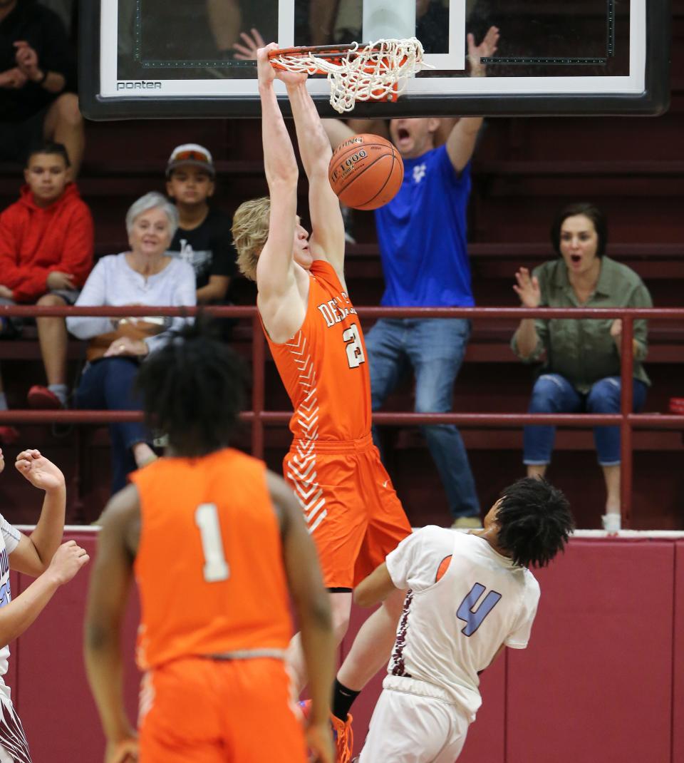 Desales' Crew Gibson (23) dunked against J-Town during the championship of the 6th Region tournament at Bellarmine Knights Hall in Louisville, Ky. on Mar. 6, 2023.