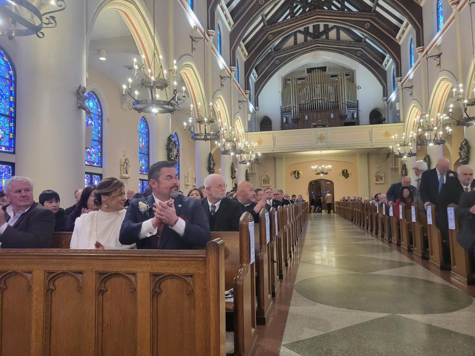 Terrebonne Parish President Jason Bergeron applauds the Terrebonne Parish Councilmembers as Judge Randall Bethancourt finishes swearing them into office during Mass Thursday, Jan. 4, at the Francis De Sales Cathedral, 500 Goode St. in Houma.