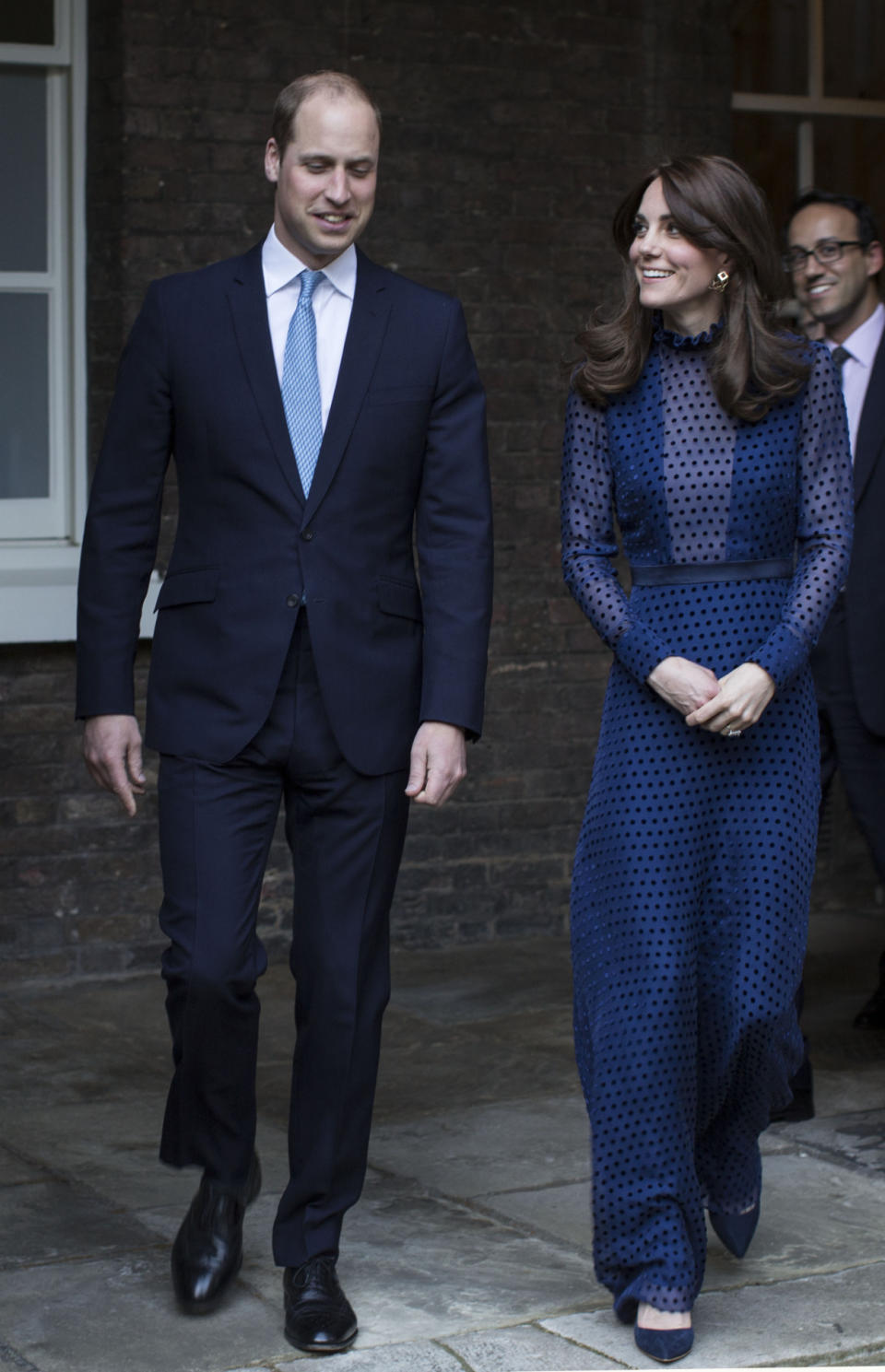 The Duchess of Cambridge in a blue Saloni dress at a reception at Kensington Palace where she met young people from Bhutan and India.