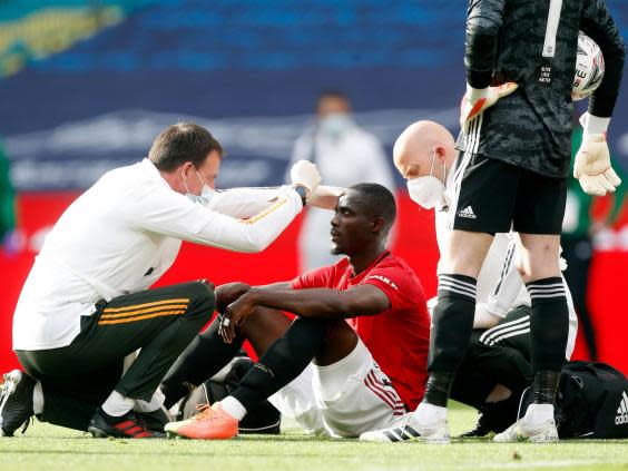 Bailly is attended to after suffering a heavy blow (Getty)
