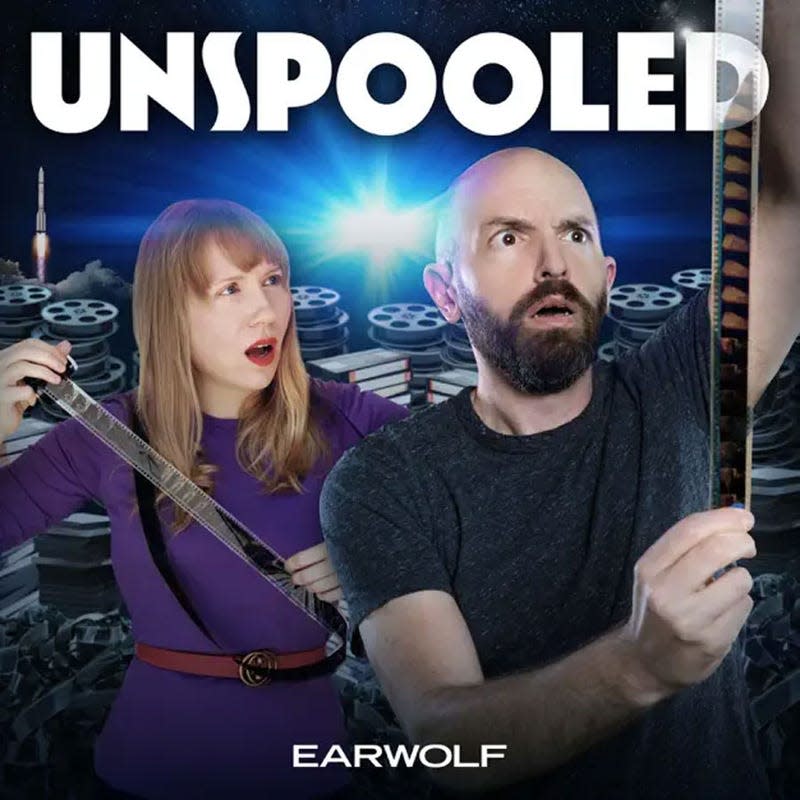 The artwork for the Unspooled podcast featuring two people looking at old film. 