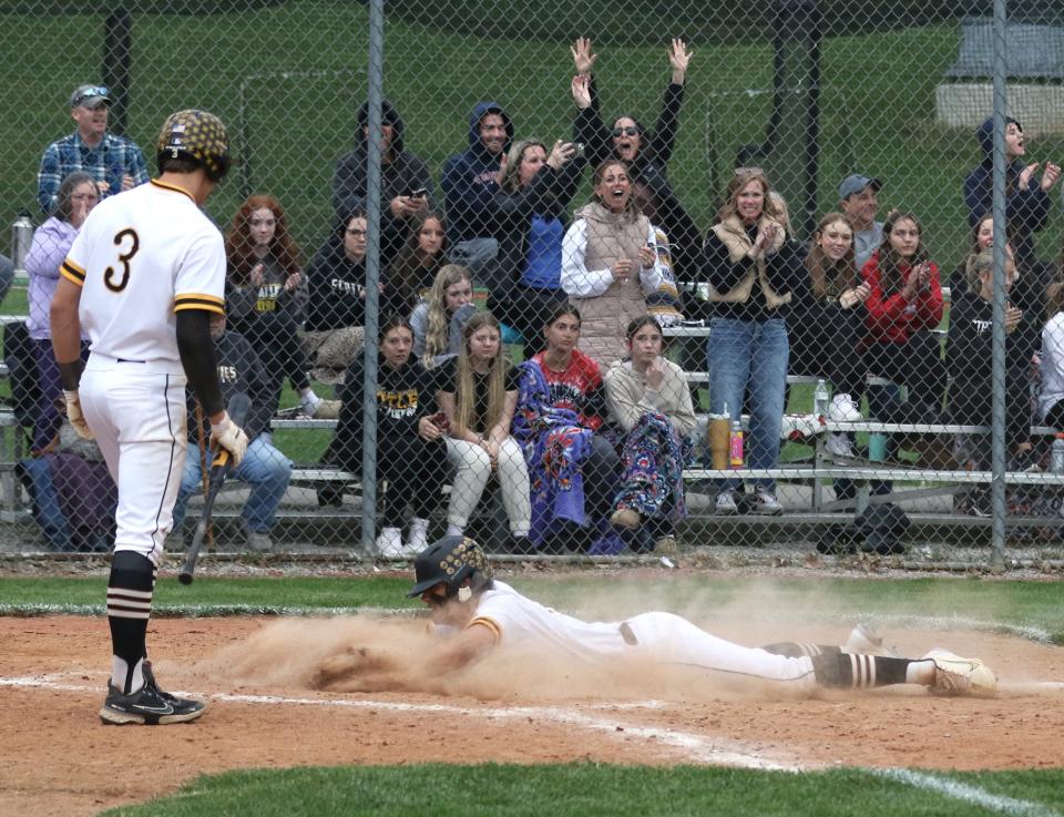 Tri-Valley's Kian Drummonds slides into home after scoring on Kade Hindel's bases-clearing double in the fifth inning against Sheridan on April 24 at Kenny Wolford Park. Hindel has been a key figure with his bat and pitching arm during the Scotties' 13-2 start.