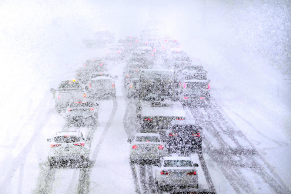 Traffic is stopped due to weather conditions on Route 93 South, Tuesday, March 14, 2023, in Londonderry, N.H. By the time the winter storm wraps up Wednesday, snow totals in New England are expected to reach a couple of feet of snow in higher elevations to several inches along the coast. (AP Photo/Charles Krupa)