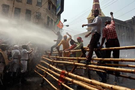 Police use a water cannon to disperse the supporters of India’s Bharatiya Janata Party (BJP) during a protest against what they call a breakdown of law and order in the state of West Bengal, in Kolkata, India May 25, 2017. REUTERS/Rupak De Chowdhuri
