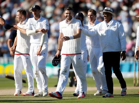 Britain Cricket - England v Pakistan - Third Test - Edgbaston - 7/8/16 England's James Anderson and Umpire Joel Wilson after the match Action Images via Reuters / Paul Childs