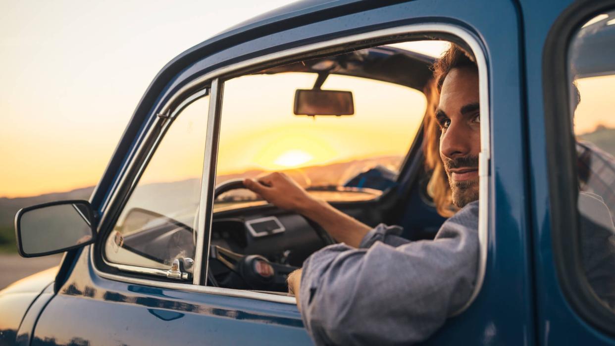 Young Couple Trip With Vintage Car.