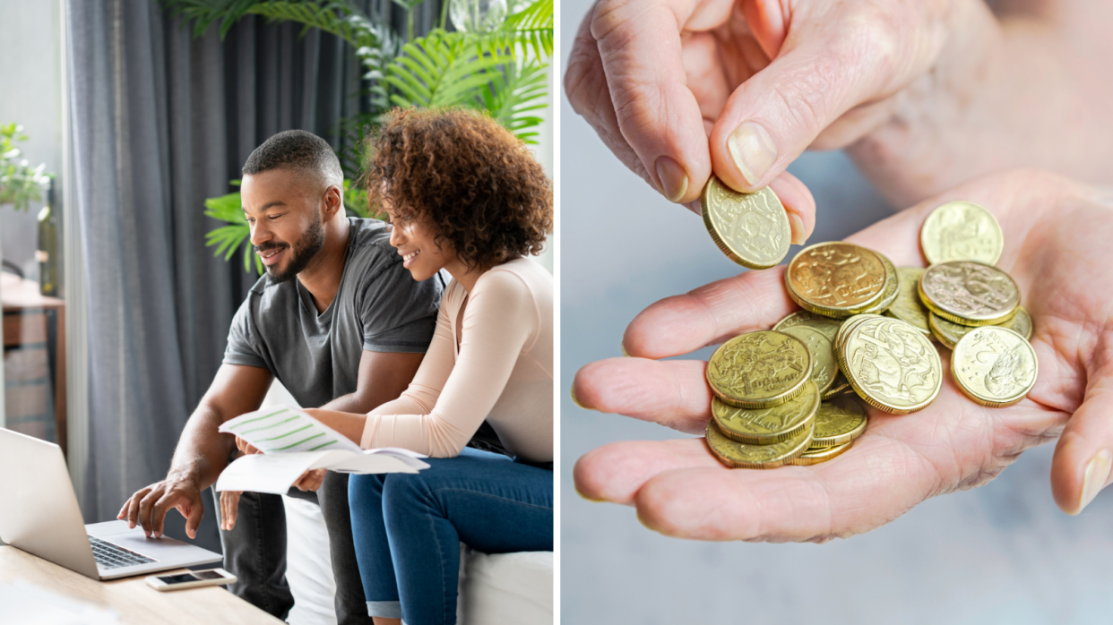 Pictured: Couple look at their finances while sitting in living room, hand full of multiple Australian $1 coins. 