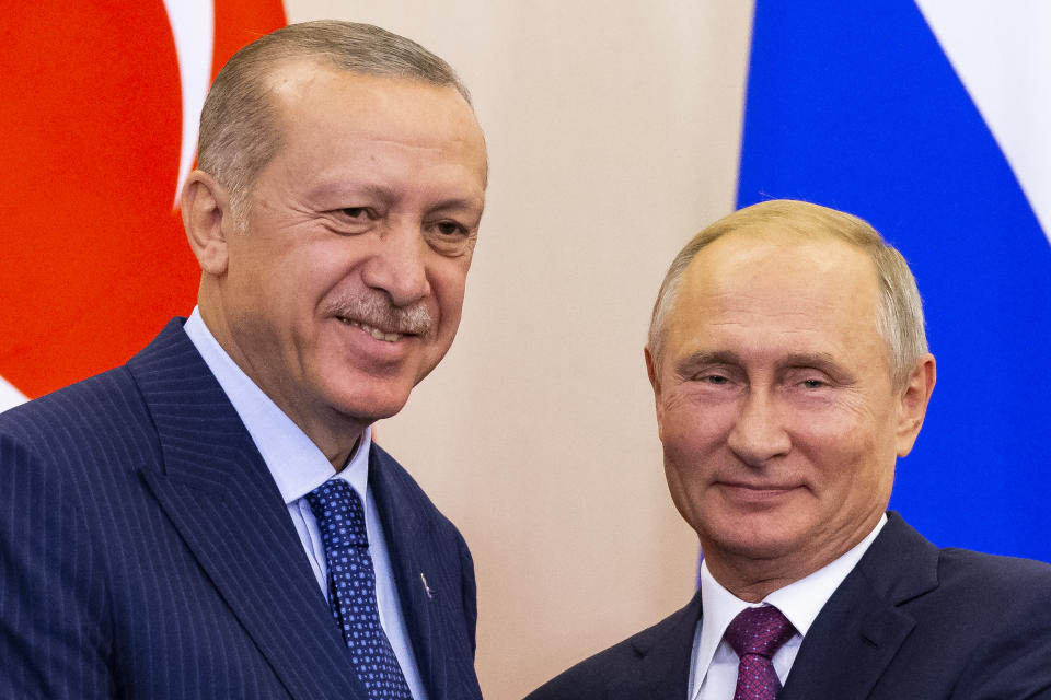 Russian President Vladimir Putin, right, and Turkish President Recep Tayyip Erdogan shake hands after their joint news conference following the talks in the Bocharov Ruchei residence in the Black Sea resort of Sochi in Sochi, Russia, Monday, Sept. 17, 2018. Turkish President Recep Tayyip Erdogan meets for the second time in 10 days with Russia's Vladimir Putin. (AP Photo/Alexander Zemlianichenko, Pool)