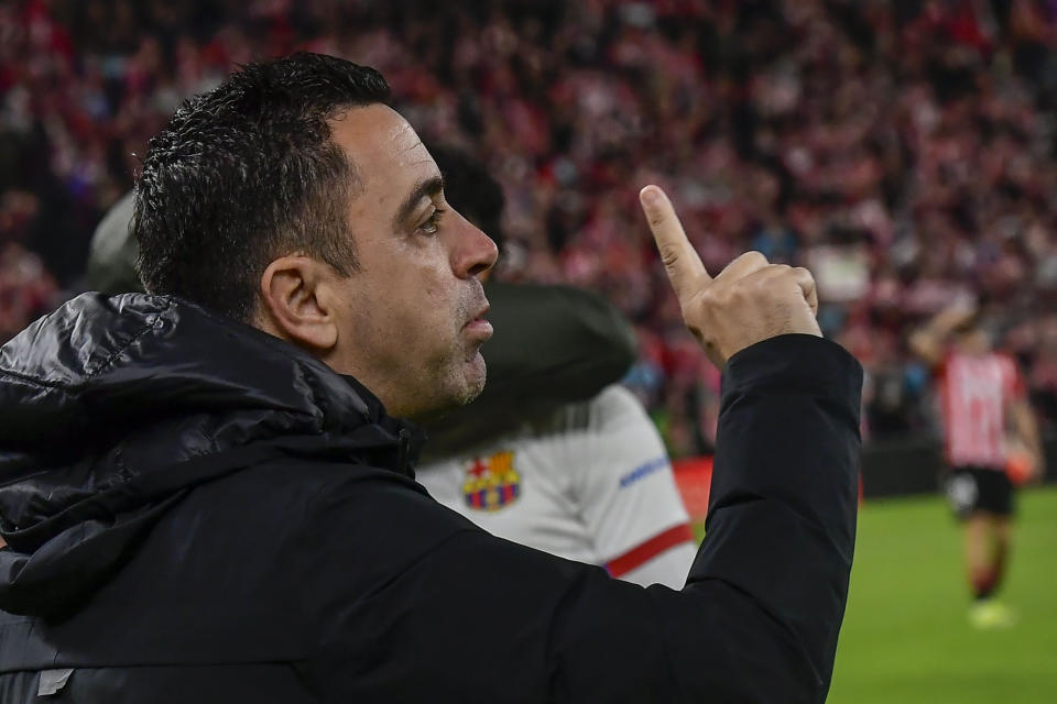 Barcelona's head coach Xavi Hernandez gives instructions to his players prior a Spanish La Liga soccer match between Athletic Bilbao and Barcelona at the San Mames stadium in Bilbao, Spain, on Sunday, March 3, 2024. (AP Photo/Alvaro Barrientos)