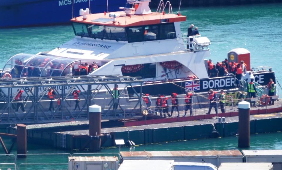 A group of suspected migrants are taken by a Border Agency ship to Dover in Kent following an incident involving a small boat in the English Channel. (PA)