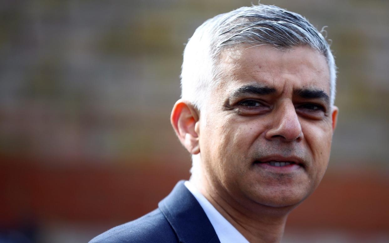 Mayor of London Sadiq Khan stands outside a polling station during local elections in London - Hannah McKay/Reuters