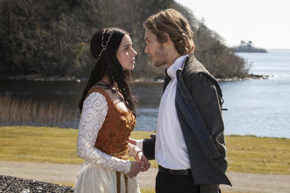 This publicity image released by The CW shows Adelaide Kane as Mary, Queen of Scots, left, and Toby Regbo as Prince Francis in a scene from the new series "Reign," premiering this fall on The CW. (AP Photo/The CW, Joss Barratt)