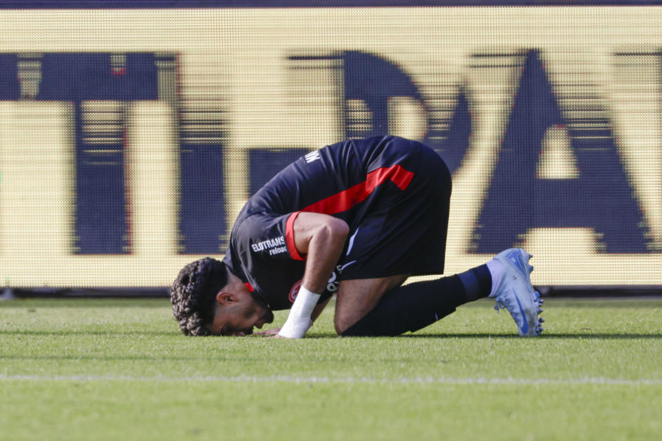 Frankfurt's Omar Marmoush celebrates after scoring his side's third goal during the Bundesliga soccer match between Holstein Kiel and Eintracht Frankfurt, at the Holstein Stadium in Kiel, Germany, Sunday, Sept. 29, 2024. (Frank Molter/dpa via AP)