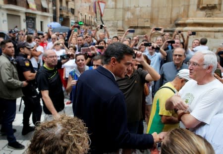 Spain’s acting Prime Minister Pedro Sanchez arrives to visit a flooded town of Orihuela