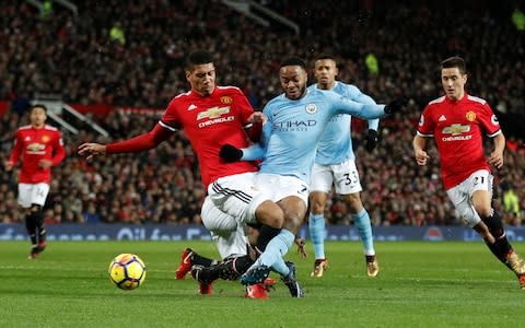 Smalling tackles Sterling - Credit: Action Images via Reuters/Carl Recine