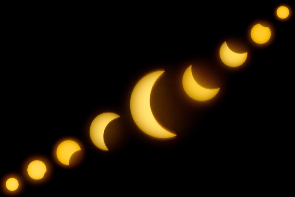 In this photo compostie illustrating the phases of the eclipse that Jacksonville Beach experienced showing the moon passing in front of the sun, starting at around 1:48 p.m., peaking at 3:05 p.m. and concluding at 4:19 p.m., is shown Monday, April 8, 2024, at Jacksonville Beach, Fla. According to Univision.com Jacksonville Beach experienced 63.8% totality.