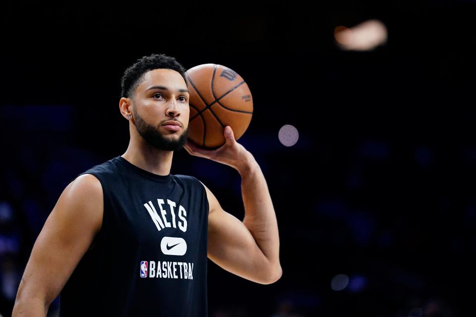 Brooklyn Nets' Ben Simmons watches practice before an NBA basketball game against the Philadelphia 76ers, Thursday, March 10, 2022, in Philadelphia. (AP Photo/Matt Slocum)