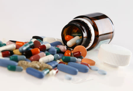 FILE PHOTO: Pharmaceutical tablets and capsules are arranged on a table in this picture illustration taken in Ljubljana August 20, 2014. REUTERS/Srdjan Zivulovic