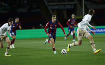 Barcelona's Gavi fights for the ball with Valencia's Mouctar Diakhaby during a Spanish La Liga soccer match between Barcelona and Valencia at the Olimpic Lluis Companys stadium in Barcelona, Spain, Monday, April 29, 2024. (AP Photo/Joan Monfort)