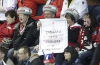 Fans of Canada cheer during their men's curling round robin game against Russia at the 2014 Sochi Olympics in the Ice Cube Curling Center in Sochi February 12, 2014. REUTERS/Ints Kalnins (RUSSIA - Tags: SPORT OLYMPICS SPORT CURLING)