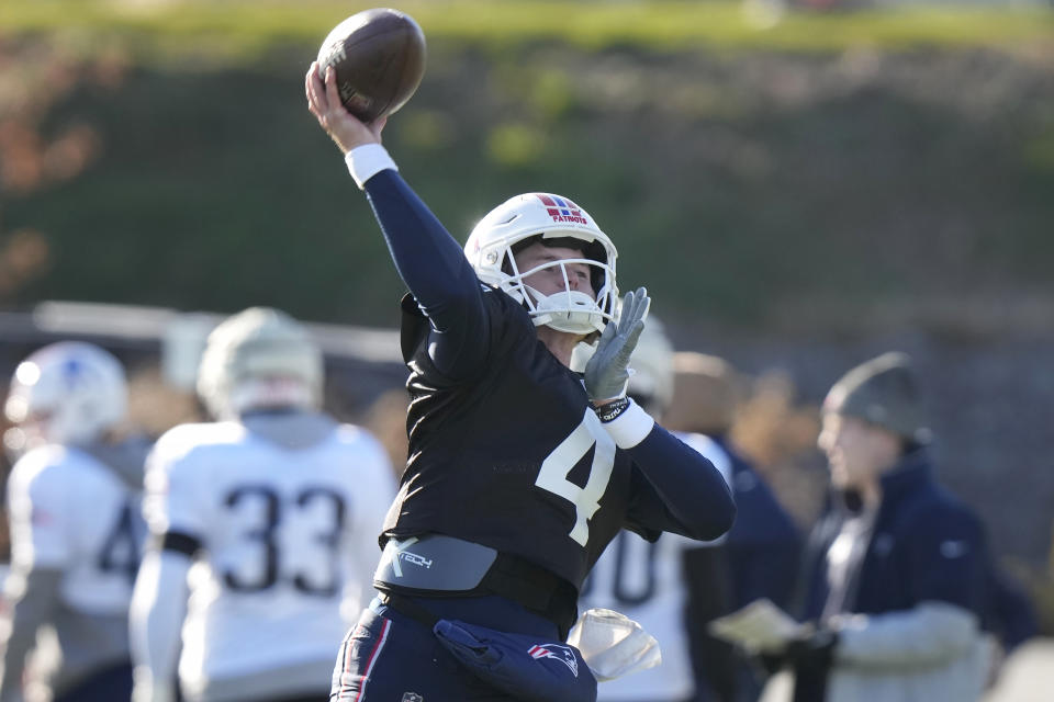 New England Patriots quarterback Bailey Zappe (4) passes during an NFL football practice, Wednesday, Nov. 29, 2023, in Foxborough, Mass. (AP Photo/Steven Senne)