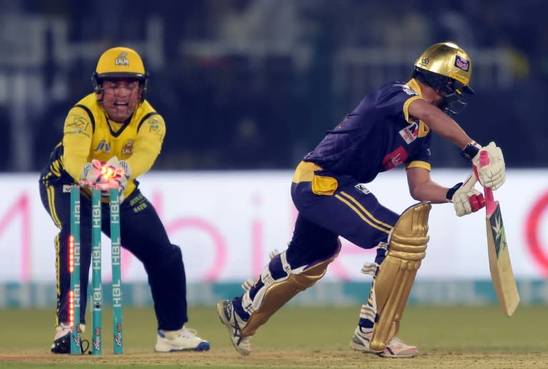 Peshawar Zalmi wicketkeeper Kamran Akmal (L) makes a succussful stump out of Quetta Gladiators batsman Muhammad Nawaz (R) during the final cricket match of the PSL between Quetta Gladiators and Peshawar Zalmi in Lahore on March 5, 2017