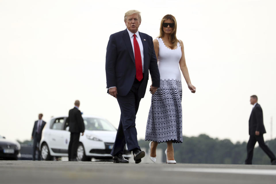 President Donald Trump and first lady Melania Trump walk to board Air Force One at Bordeaux–Mérignac Airport, Monday, Aug. 26, 2019 in Bordeaux, France, to return to Washington following the G-7 summit. (AP Photo/Andrew Harnik)