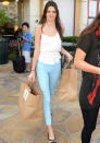 Celebrities in pastel fashion: Kendall Jenner styled her mint-green jeans with a loose white cami. <br><br>© Rex