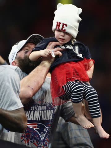 <p>Jamie Squire/Getty</p> Julian Edelman celebrates with his daughter Lily at the end of the Super Bowl LIII at Mercedes-Benz Stadium on February 3, 2019.