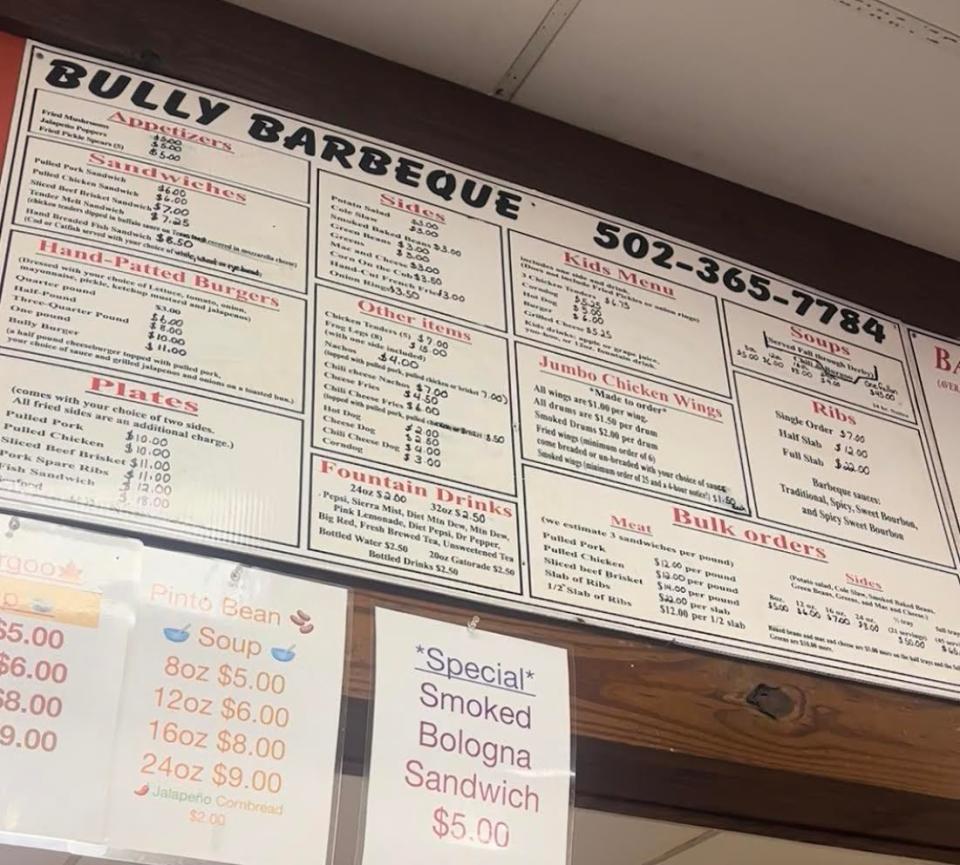 Bully Barbeque's menu, which hangs behind the front counter, features slow-cooked meats and homemade side dishes.