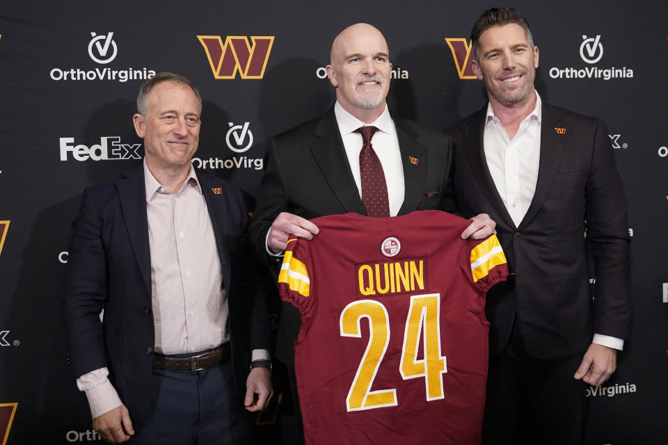 Head coach Dan Quinn of the Washington Commanders poses for a photo with managing partner Josh Harris and general manager Adam Peters. (Photo by Jess Rapfogel/Getty Images)