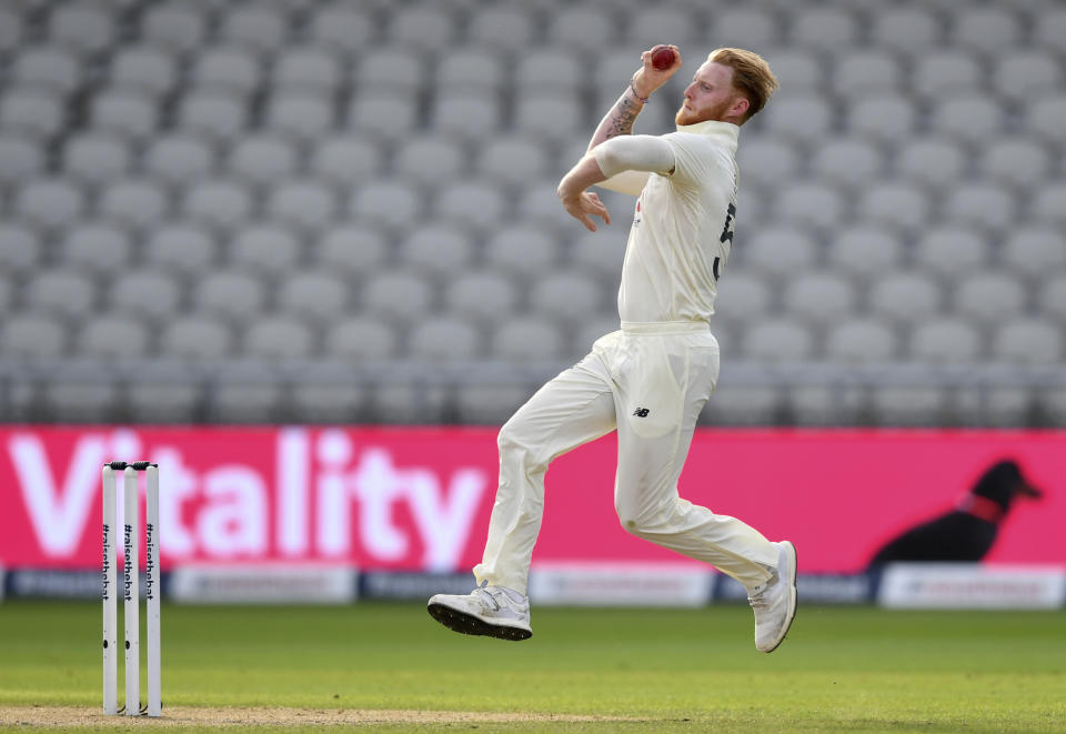 England's Ben Stokes bowls a delivery during the third day of the first cricket Test match between England and Pakistan at Old Trafford in Manchester, England, Friday, Aug. 7, 2020. (Dan Mullan/Pool via AP)