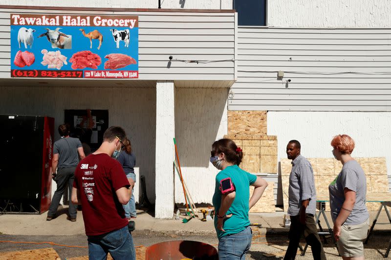 FILE PHOTO: People are seen outside Tawakal Halal Grocery store following the protests against the death in Minneapolis police custody of George Floyd, in Minneapolis