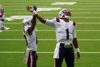 New England Patriots quarterback Cam Newton (1) and receiver Damiere Byrd (10) celebrate a touchdown against the Houston Texans during the second half of an NFL football game, Sunday, Nov. 22, 2020, in Houston. (AP Photo/David J. Phillip)