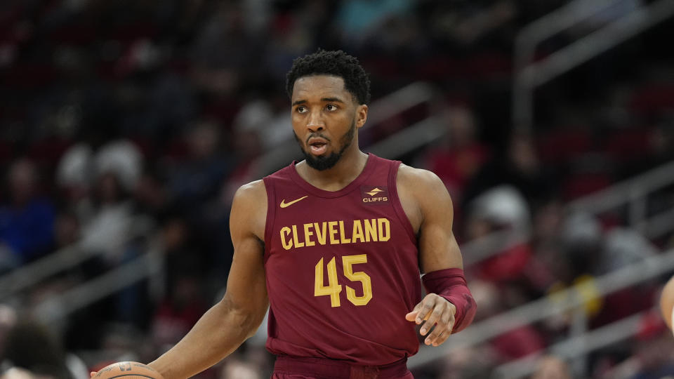 Cleveland Cavaliers' Donovan Mitchell (45) brings the ball up the court against the Houston Rockets during the first half of an NBA basketball game Saturday, March 16, 2024, in Houston. (AP Photo/David J. Phillip)